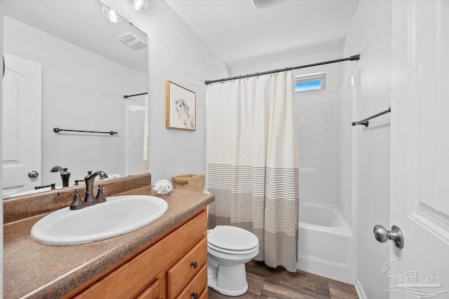 3966 Willow Glen Dr, Pace, FL 32571 - bathroom featuring shower / bathtub combination with curtain, vanity, visible vents, toilet, and wood finished floors