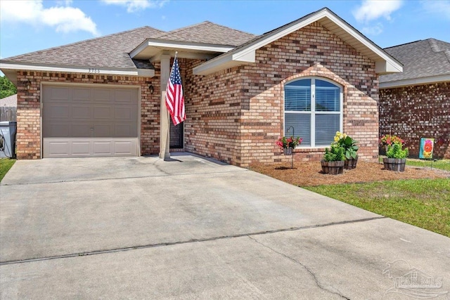 3966 Willow Glen Dr, Pace, FL 32571 - single story home featuring concrete driveway, brick siding, an attached garage, and a shingled roof