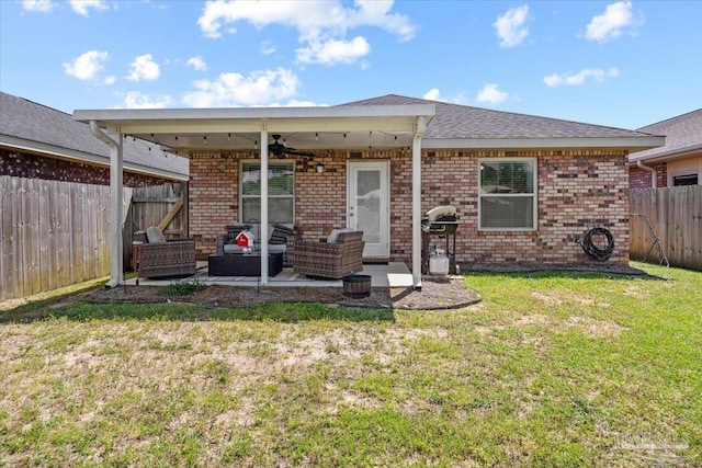 3966 Willow Glen Dr, Pace, FL 32571 - back of house featuring an outdoor living space, a ceiling fan, a patio area, a fenced backyard, and a yard