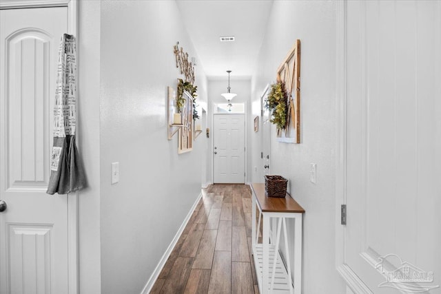 3966 Willow Glen Dr, Pace, FL 32571 - hall featuring visible vents, baseboards, and wood finished floors