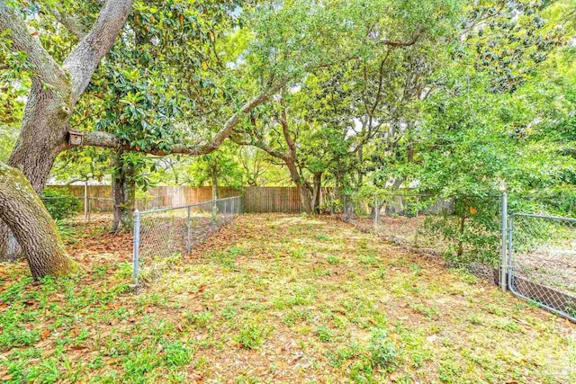 5791 Coronada Blvd Apt 2, Pensacola, FL 32507 - view of yard with a fenced backyard