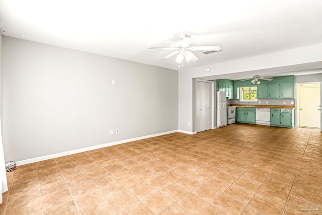 5791 Coronada Blvd Apt 2, Pensacola, FL 32507 - unfurnished living room featuring baseboards, ceiling fan, visible vents, and a sink