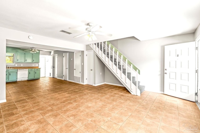 5791 Coronada Blvd Apt 2, Pensacola, FL 32507 - unfurnished living room with visible vents, a ceiling fan, stairs, and light tile patterned floors