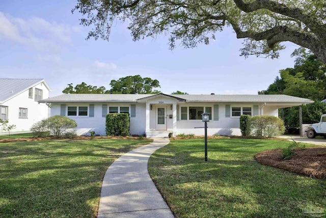 single story home featuring an attached carport and a front yard