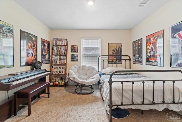 bedroom with visible vents and carpet floors