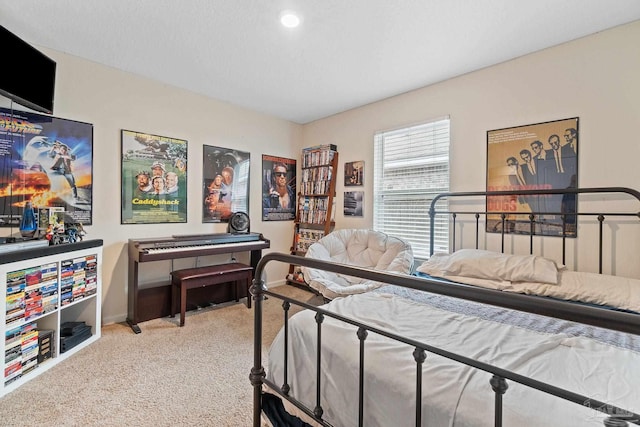 carpeted bedroom featuring baseboards