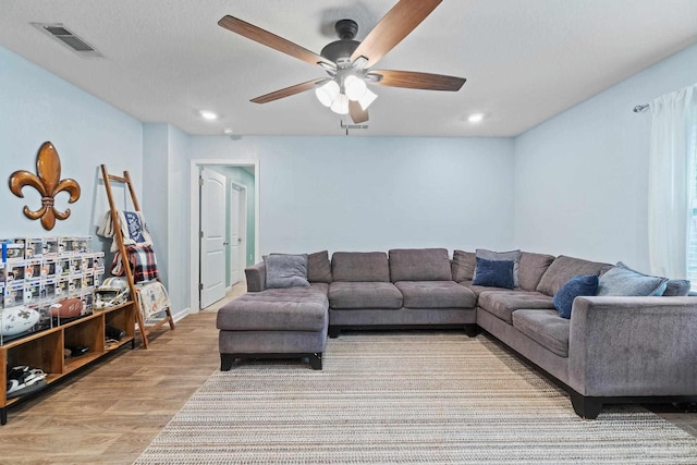 living room featuring visible vents, wood finished floors, ceiling fan, and recessed lighting