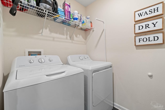 laundry room with laundry area and washer and clothes dryer