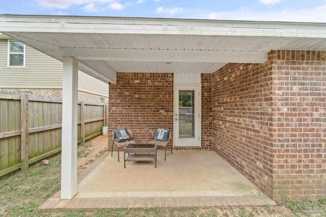 view of patio / terrace featuring fence