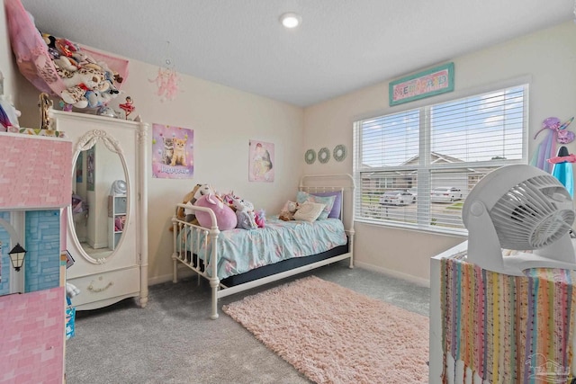 bedroom featuring carpet flooring and baseboards