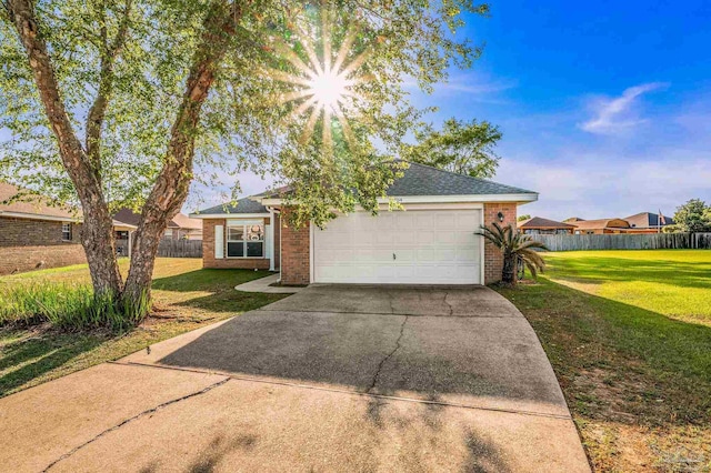2454 Flintstone Dr, Cantonment, FL 32533 - view of front of property with brick siding, driveway, an attached garage, and roof with shingles