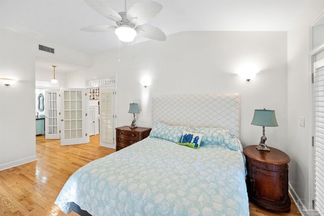 bedroom with hardwood / wood-style floors and ceiling fan