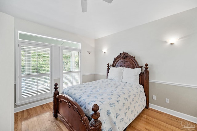 bedroom with ceiling fan and light hardwood / wood-style flooring