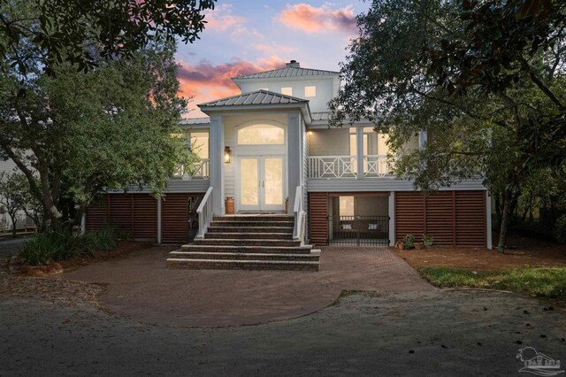 back house at dusk with french doors