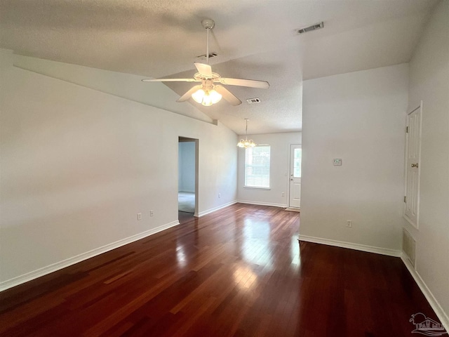 5538 Rowell Rd, Milton, FL 32583 - unfurnished room with dark wood-style flooring, ceiling fan, baseboards, lofted ceiling, and a chandelier