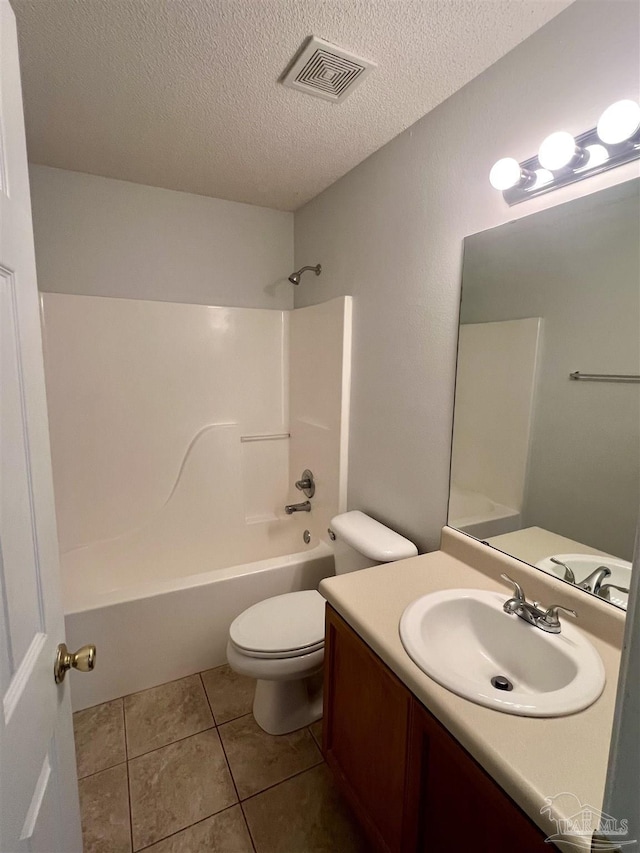 5538 Rowell Rd, Milton, FL 32583 - bathroom featuring toilet, a textured ceiling, vanity, shower / bath combination, and tile patterned flooring