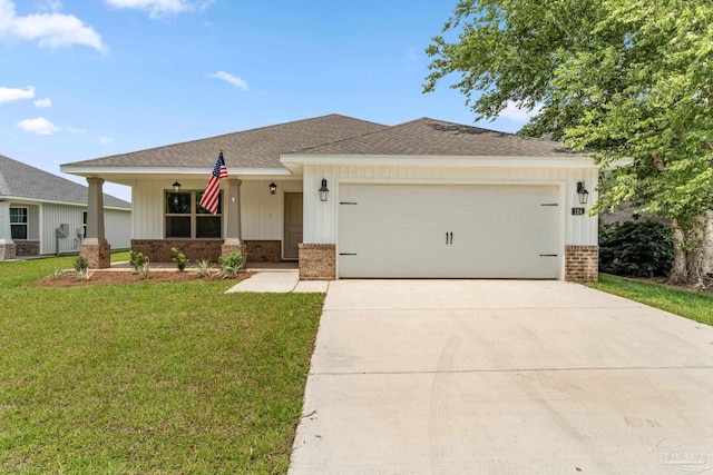 view of front of house with a front lawn and a garage