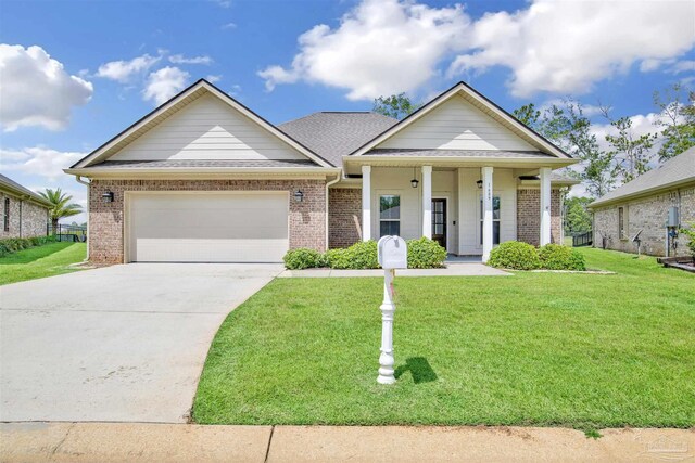 view of front of home featuring a garage, a porch, and a front yard