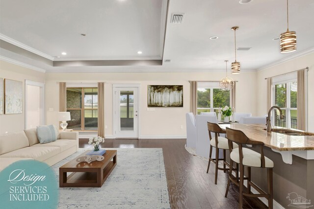 entrance foyer with ornamental molding, dark hardwood / wood-style floors, and ceiling fan