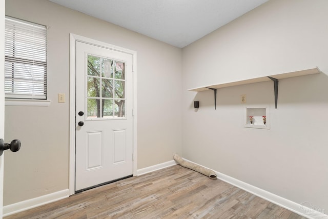 washroom featuring washer hookup and light wood-type flooring