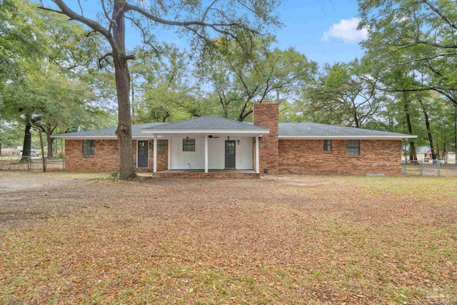 rear view of house with ceiling fan