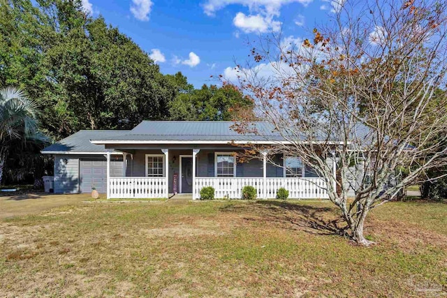 ranch-style house featuring a front lawn and a garage