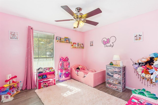 bedroom with hardwood / wood-style floors and ceiling fan