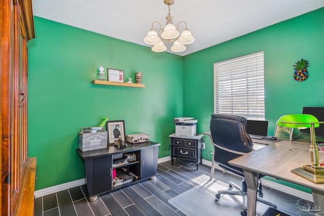 home office with dark hardwood / wood-style flooring and a notable chandelier