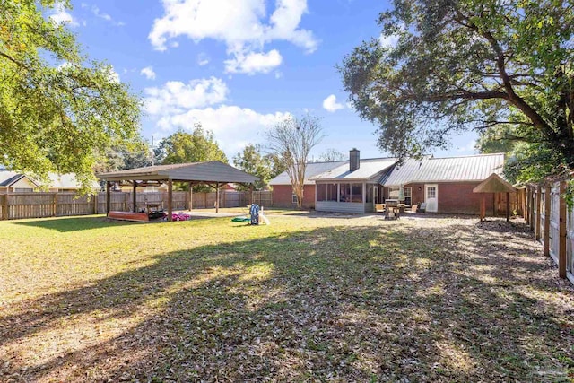 view of yard with a sunroom and a deck