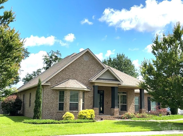 6120 Buttonbrook Dr, Pace, FL 32571 - craftsman house with brick siding and a front yard