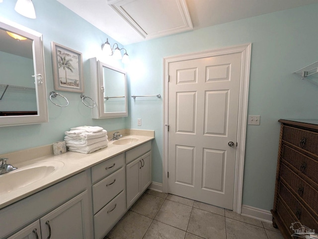 14391 Perdido Key Dr Unit D, Pensacola, FL 32507 - full bath featuring tile patterned flooring, baseboards, and double vanity