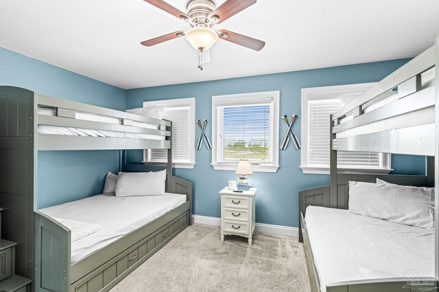 14391 Perdido Key Dr Unit D, Pensacola, FL 32507 - bedroom with light colored carpet, baseboards, and a ceiling fan