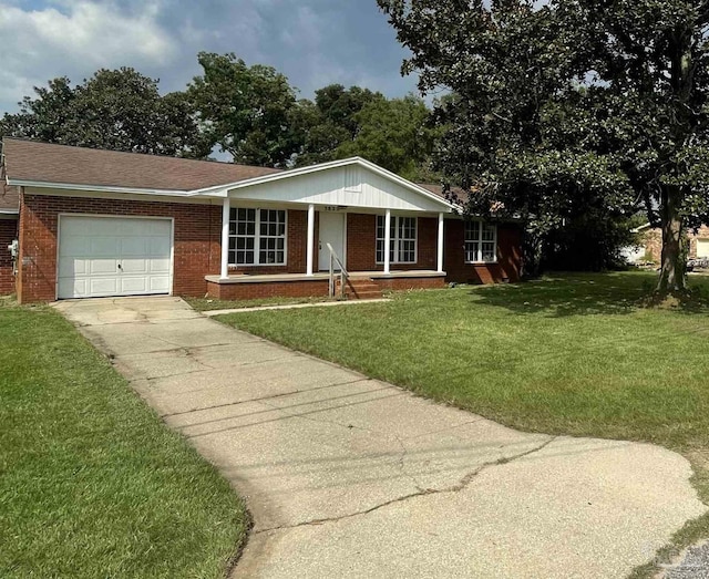 single story home featuring a front yard and a garage