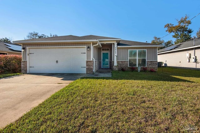 view of front of house with brick siding, a garage, driveway, and a front yard