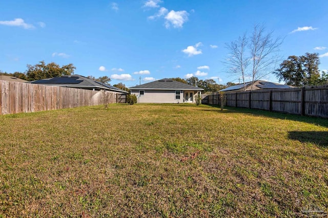 view of yard with a fenced backyard