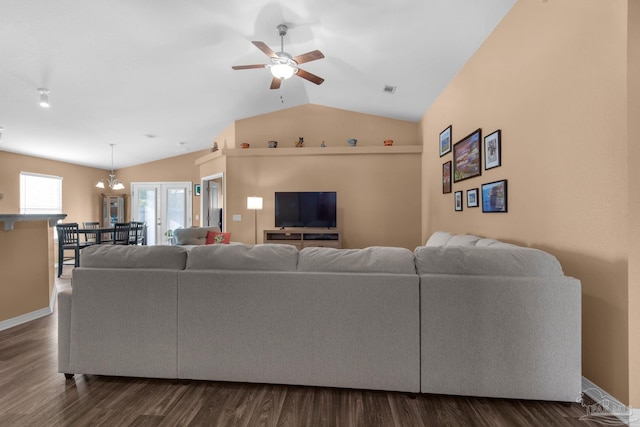 living area featuring vaulted ceiling, dark wood-style floors, baseboards, and ceiling fan