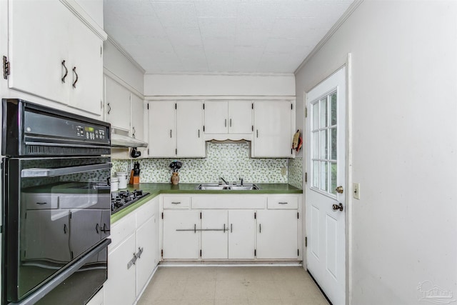 kitchen featuring black appliances, white cabinets, decorative backsplash, and sink