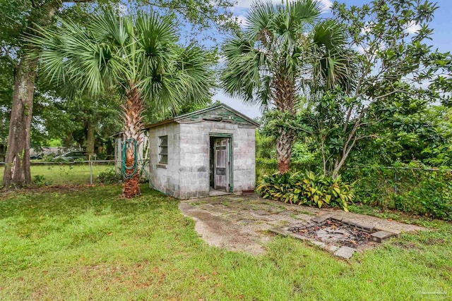 view of outbuilding featuring a yard