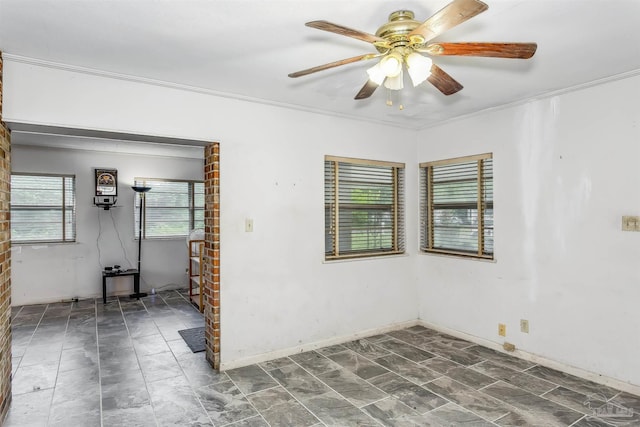 empty room with ceiling fan and ornamental molding