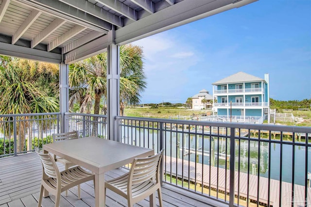 wooden deck with a water view