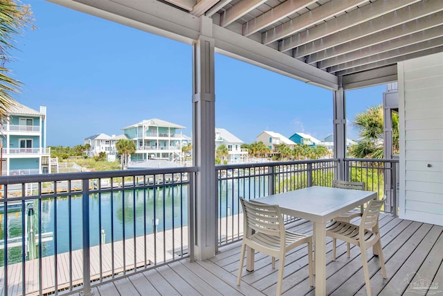 wooden terrace with a water view