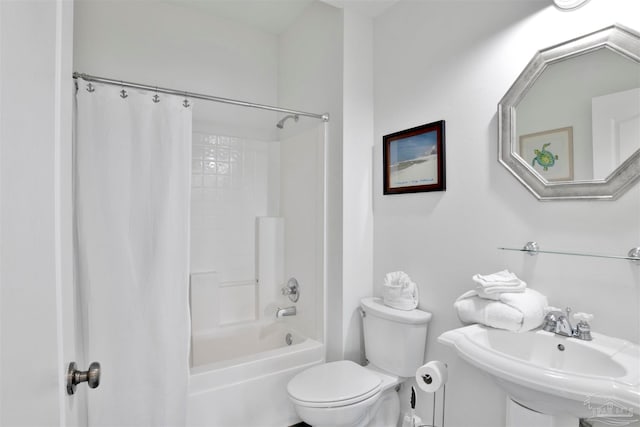 full bathroom with sink, shower / bath combo, and toilet