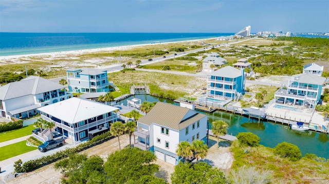 bird's eye view featuring a view of the beach and a water view