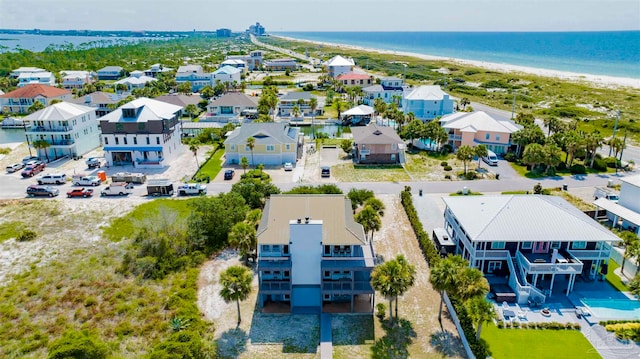 drone / aerial view featuring a water view and a beach view