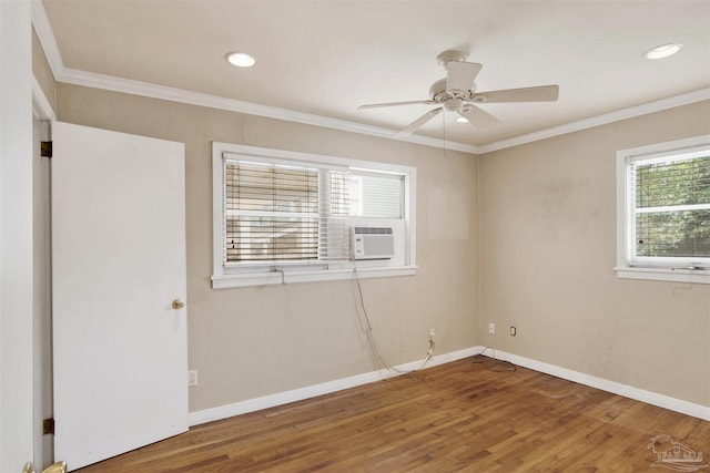 1001 E Bobe St, Pensacola, FL 32503 - spare room featuring crown molding, a ceiling fan, baseboards, recessed lighting, and wood finished floors