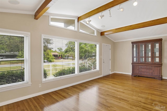 1001 E Bobe St, Pensacola, FL 32503 - spare room with baseboards, lofted ceiling with beams, light wood-style flooring, and a healthy amount of sunlight