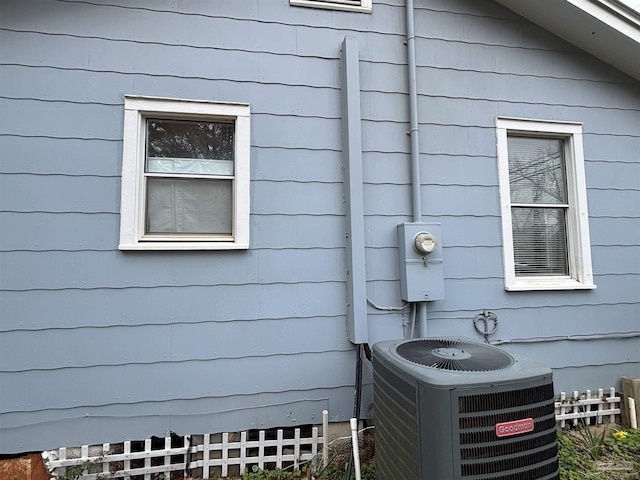 exterior details with electric meter and central AC unit