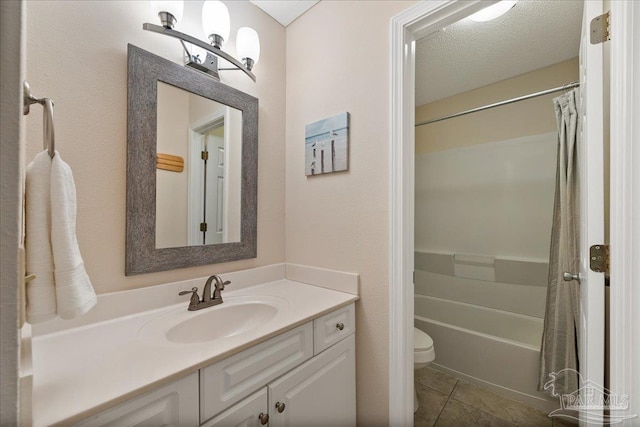 bathroom featuring toilet, shower / bath combo with shower curtain, vanity, a textured ceiling, and tile patterned floors