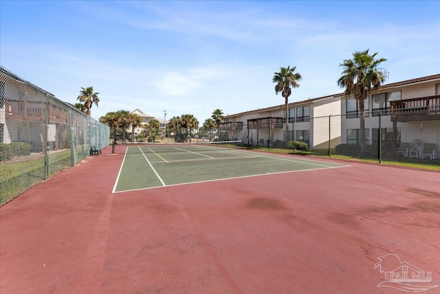 view of sport court featuring community basketball court and fence