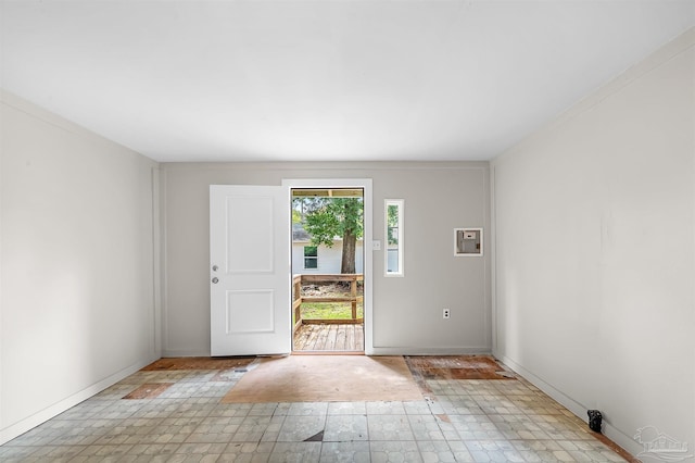 entryway featuring crown molding